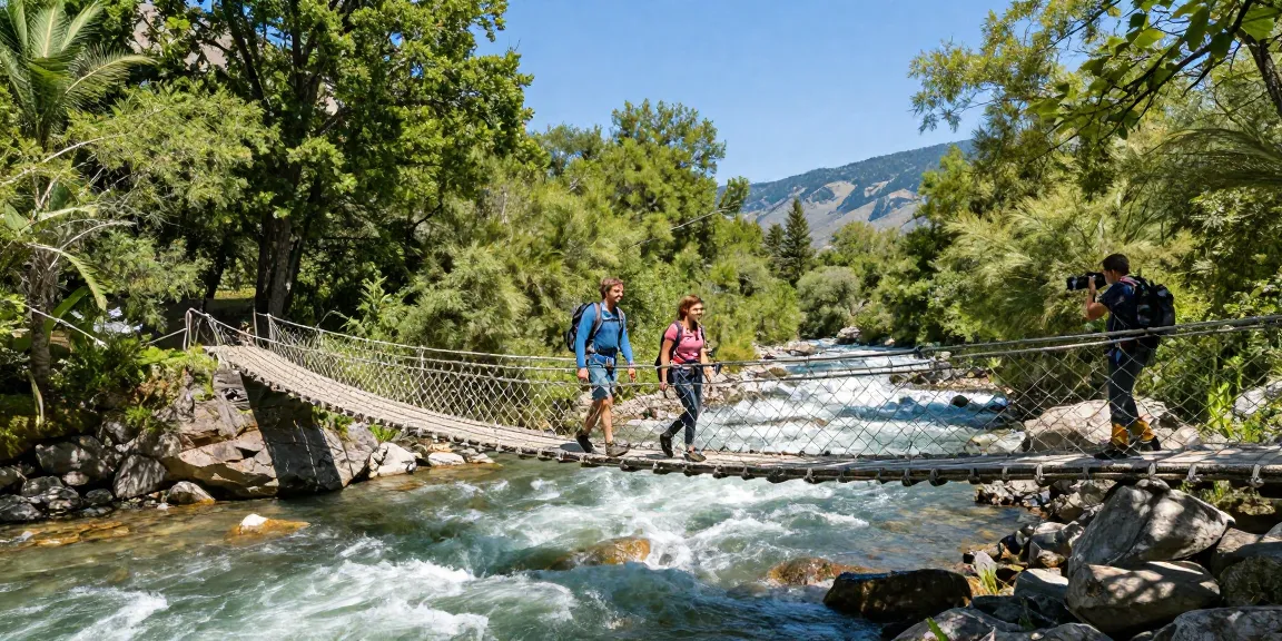 River Rope Bridge crossing a picturesque landscape with hikers enjoying breathtaking views.